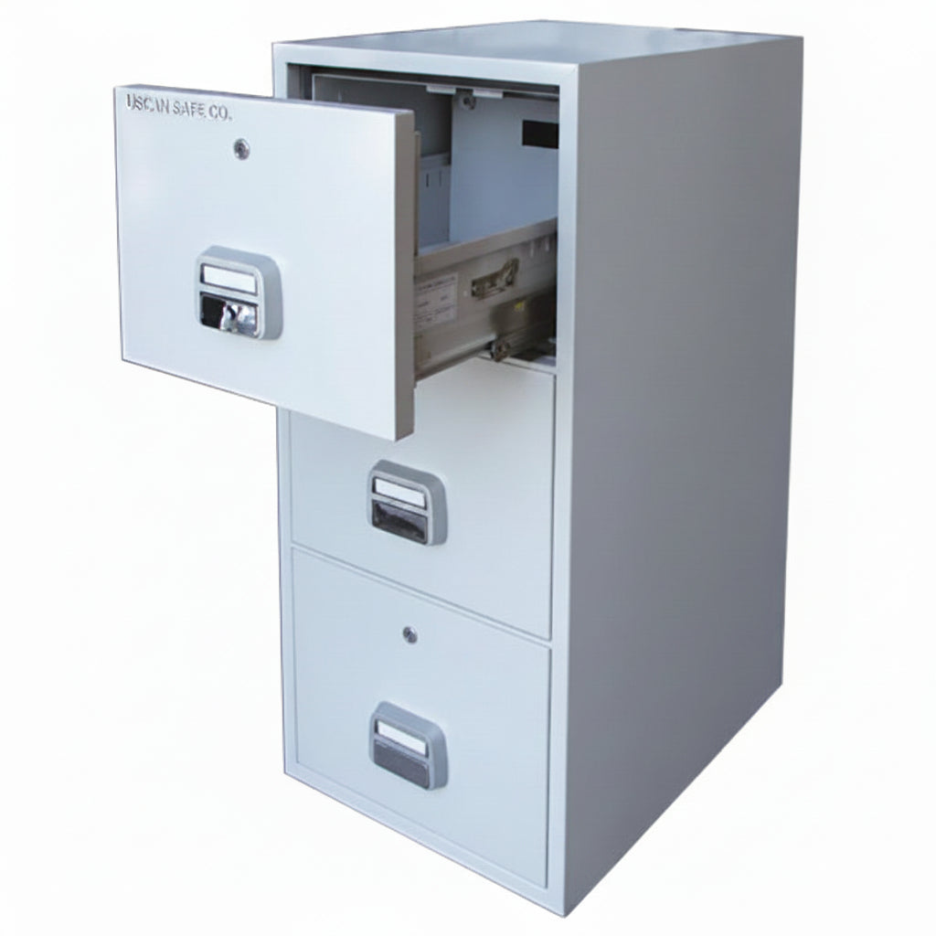 A three-drawer metal filing cabinet with the top drawer pulled open, showing an interior slot. The cabinet is light gray with silver handles and a small SP logo watermark in the bottom-left corner.